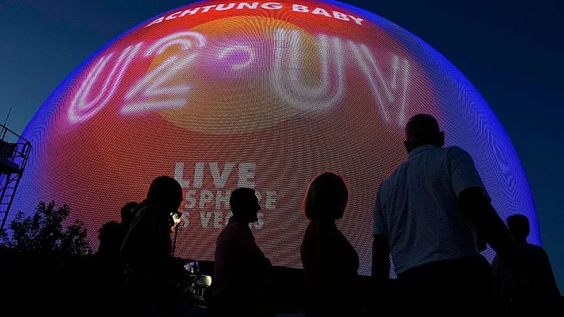 People arrive for the opening night of the Sphere and U2's “UV Achtung Baby" show, Friday, Sept. 29, 2023, in Las Vegas.