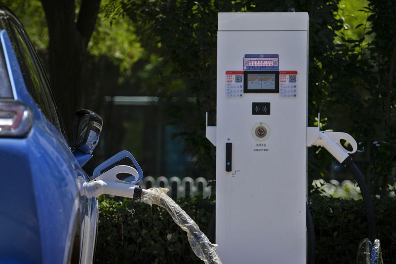 A Chinese electric vehicle charges in Beijing, China