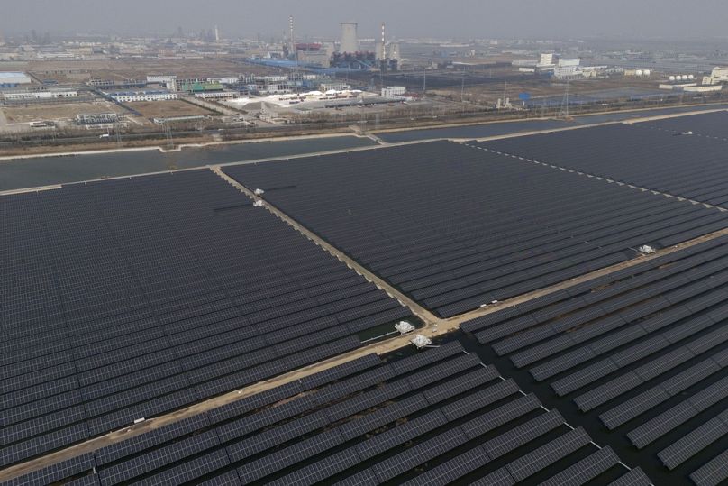  A solar farm operates near a chemical plant on the outskirts of Weifang in eastern China's Shandong province 