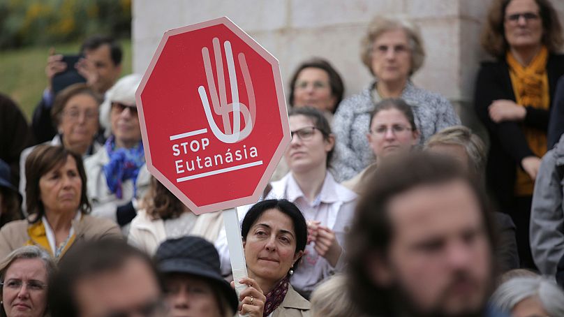 People protest euthanasia in May 2018 on the steps of the Portuguese parliament in Lisbon.