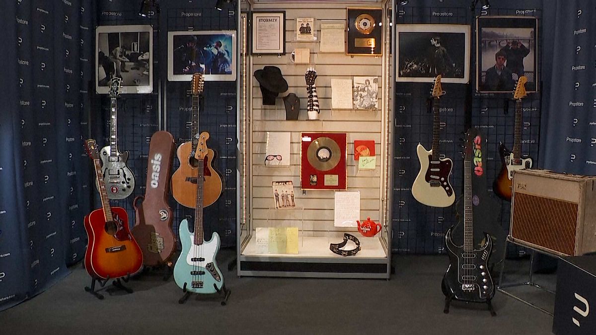 Oasis memorabilia auction to feature Noel Gallagher’s silver sparkle guitar and Liam’s tambour