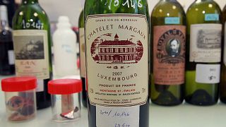 In this photo dated Tuesday, Nov. 12, 2013, example of a counterfeit bottle of wine is displayed in a lab run by the French Finance ministry in Bordeaux, southwestern France. 