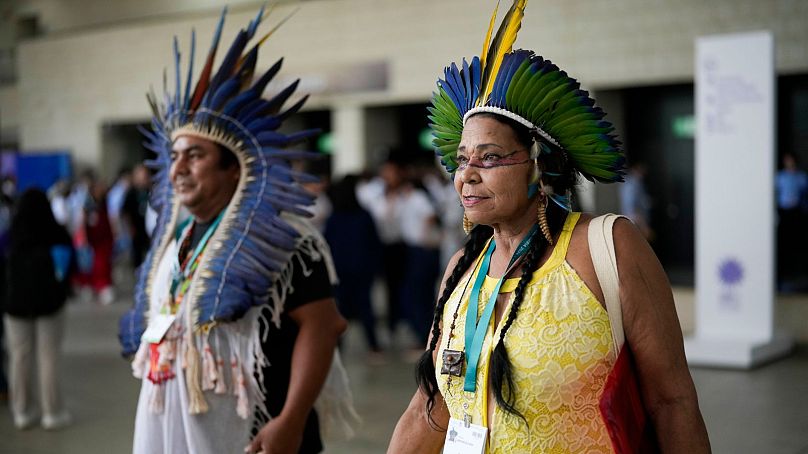 Members of Brazil's Indigenous delegation arrive to the opening ceremony of COP16.