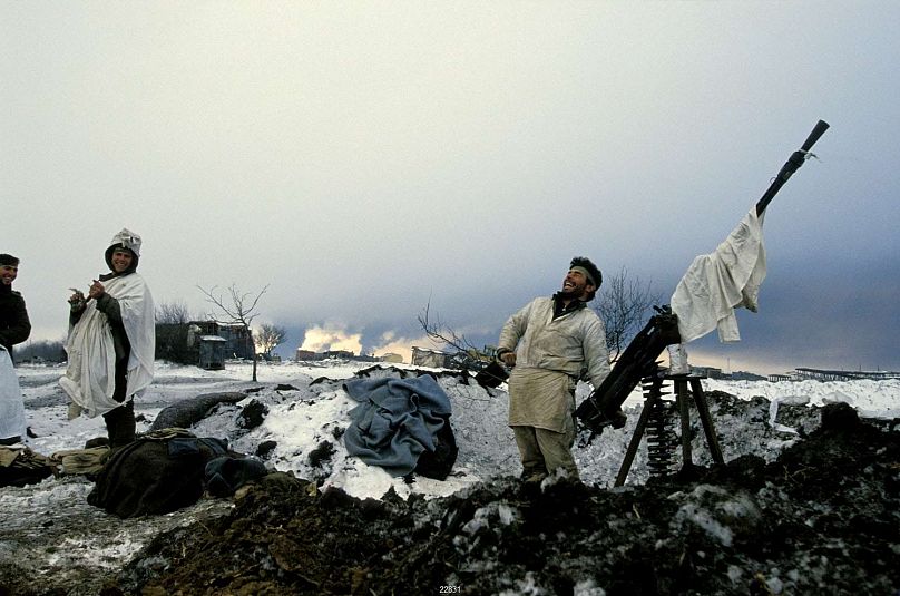 A Chechen soldier laughs after repelling a Russian attack on the outskirts of Grozny in December 1994