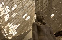 A giant stone figure of Ramses II stands in the Grand Egyptian Museum in Giza, near Cairo, Egypt