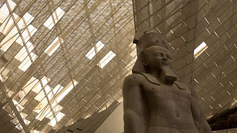 A giant stone figure of Ramses II stands in the Grand Egyptian Museum in Giza, near Cairo, Egypt