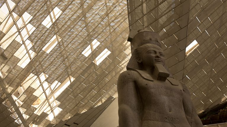 A giant stone figure of Ramses II stands in the Grand Egyptian Museum in Giza, near Cairo, Egypt