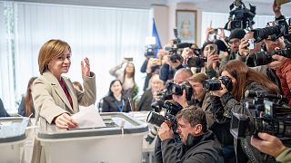 Moldova's President Maia Sandu prepares to cast her vote, in Chisinau, 20 October 2024
