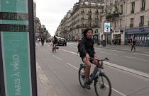 A man rides past a bicycle counter in Paris, Wednesday, 13 September 2023