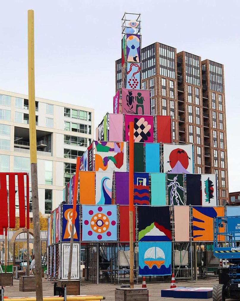 Temple of Peace installation, with 80 flags designed by teams of design graduates, artists and refugees
