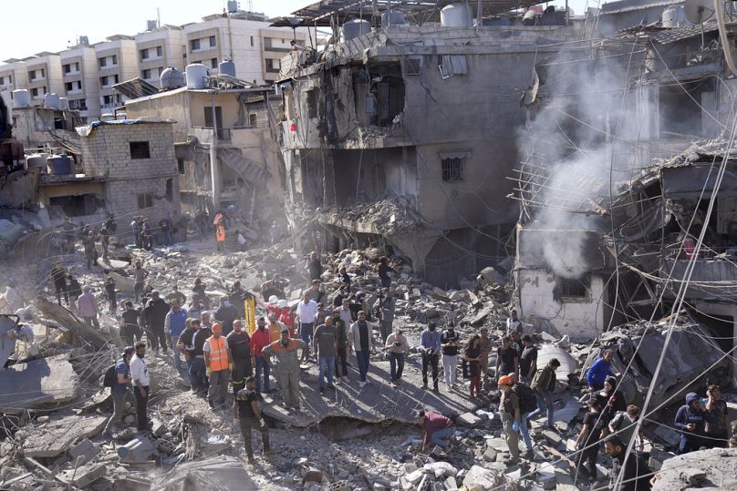 Rescue workers search for victims at popular neighbourhood in the south of Beirut that was hit by Israeli airstrikes.