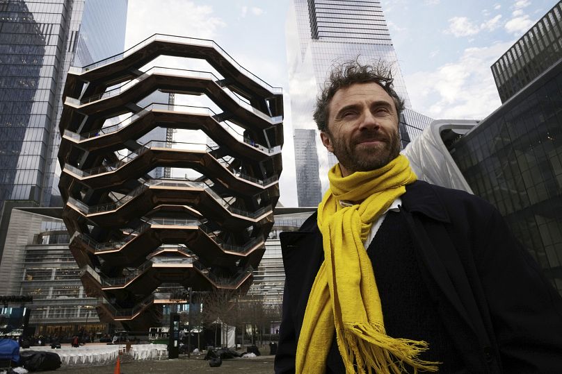 British designer Thomas Heatherwick poses in front of the Vessel on its opening day at Hudson Yards in New York, 2019.