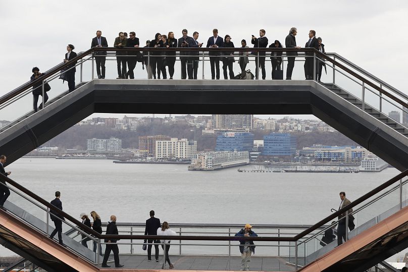 Visitors to the Vessel climb its staircases on its opening day at Hudson Yards in New York, 2019.