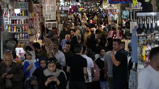 File picture of people walk through the old main bazaar of Tehran, Iran