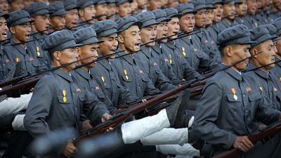 North Korean soldiers in historic uniforms march during a parade on the Kim Il Sung Square, Saturday, Oct. 10, 2015, in Pyongyang, North Korea.