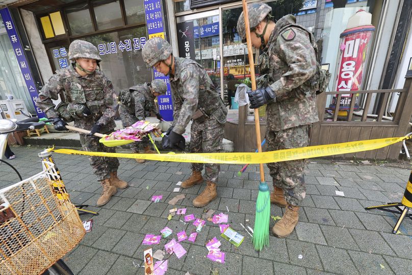 South Korean army soldiers collect the trash from a balloon presumably sent by North Korea in Incheon, South Korea.