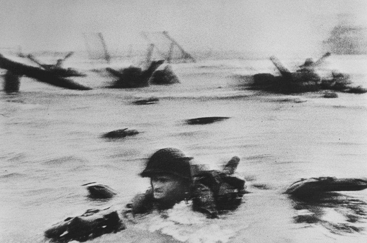 A soldier stationed along the seashore during the Normandy landings. 