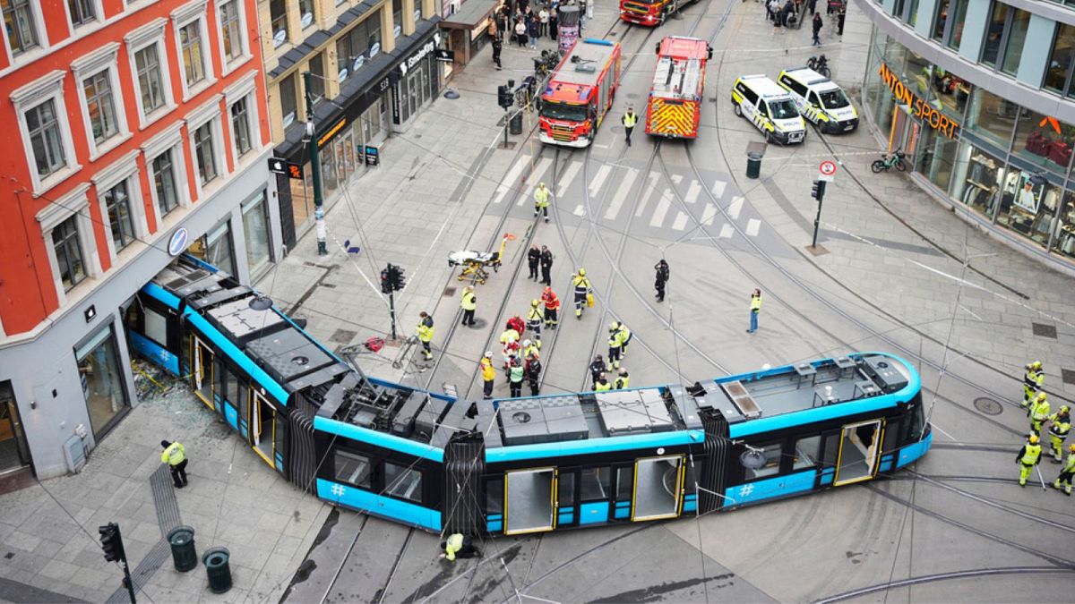 Emergency workers at the scene of a derailed tram that crashed into a building in downtown Oslo, Norway, Tuesday Oct. 29, 2024.