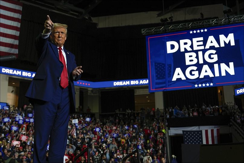 Republican presidential nominee former President Donald Trump points at a campaign rally at PPL Centre.