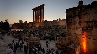 Visitors arrive for the concert of the French Pianist Simon Ghraichy in the ancient northeastern city of Baalbek, Lebanon, Sunday, July 17, 2022.