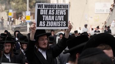 Ultra-Orthodox Jews protest outside Israeli military enlistment office