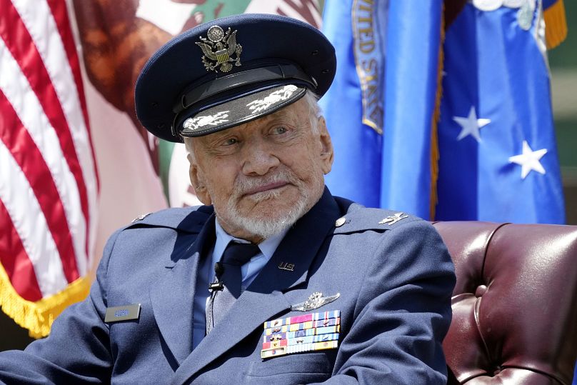 Buzz Aldrin, retired, listens to a speaker during a ceremony awarding him with an honorary appointment of Brigadier General at the Los Angeles Air Force Base Friday, 2024