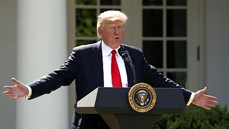 President Trump frames the Paris Agreement as a conspiracy to beggar the US economy as he announces withdrawal in June 2017