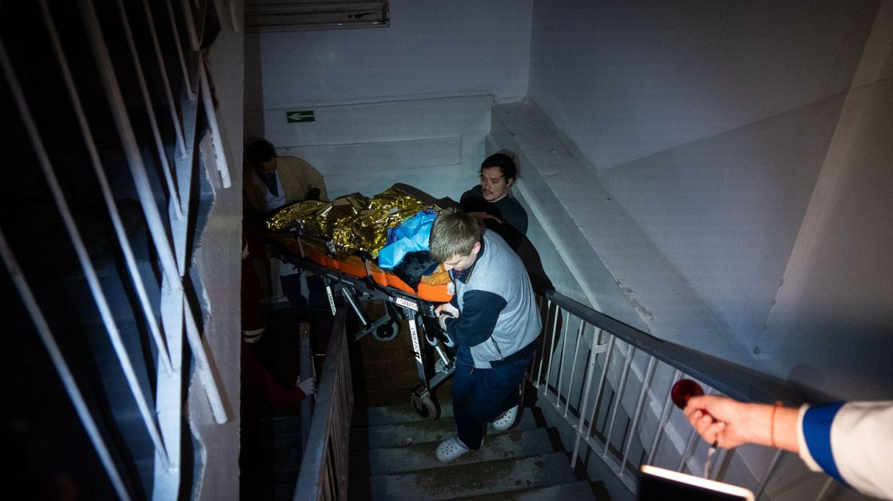 After a Russian attack, 13-year-old Artur is stretchered up six flights of hospital stairs by torchlight to receive treatment. His arm was later amputated.