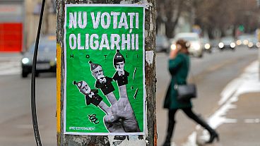 A poster depicting, from left, Moldova's Prime Minister Pavel Filip, President Igor Dodon and Israeli born Modovan businessman and politician Ilan Shor, which reads "Don't Vot