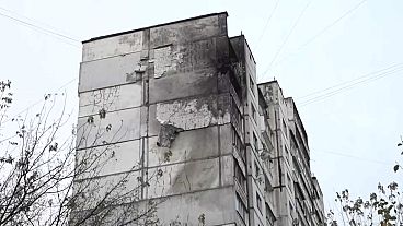 Damage to a downtown apartment and office block in Kyiv after Russian drone debris rained on the capital. 