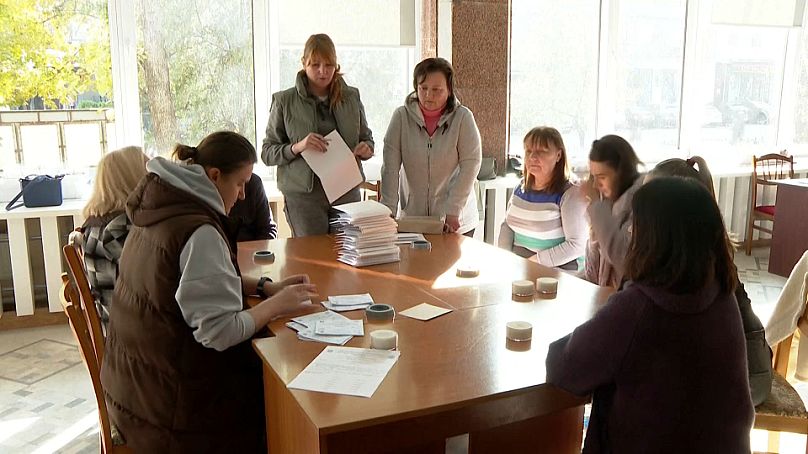 Election workers prepare ballots at a polling station in the capital Chișinău, 2 November, 2024