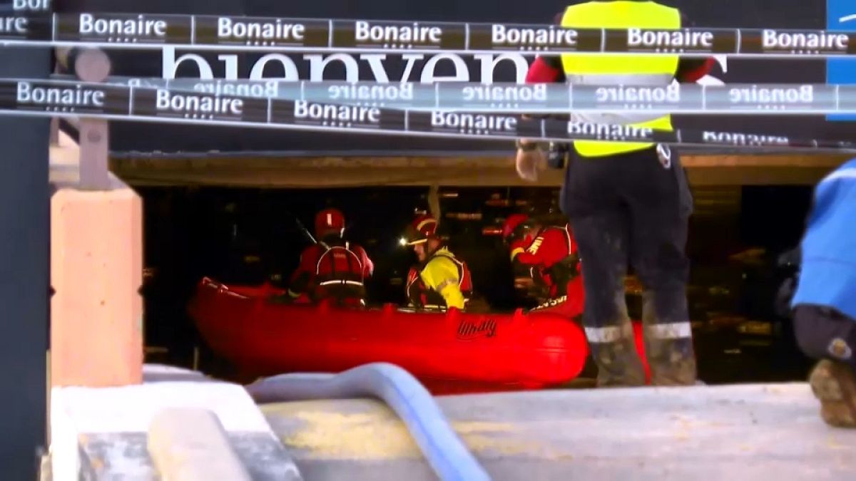 Rescue teams drain underground garages in search for missing people in Valencia