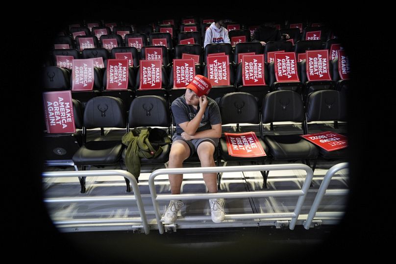 A supporter waits for the start of a Trump rally in Milwaukee, Wisconsin.