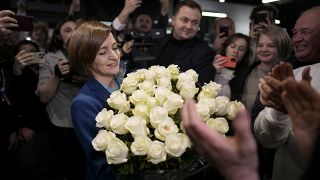 Moldova's President Maia Sandu celebrates with supporters the preliminary results of the presidential runoff in Chișinău, 3 November, 2024
