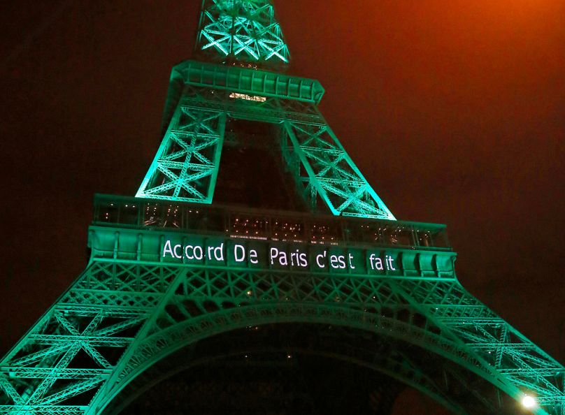 The Eiffel Tower lit up in green to mark the success of the Paris Agreement  in 2015.