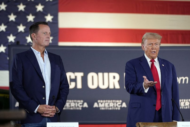 Republican presidential nominee former President Donald Trump arrives as Richard Grenell watches at a campaign event at a farm, Monday, Sept. 23, 2024, in Smithton, Pa.