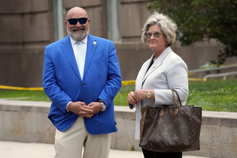 Senior strategist's for former President Donald Trump, Chris LaCivita and Susie Wiles stand outside after Trump arrived at the E. Barrett Prettyman U.S. Federal Courthouse.