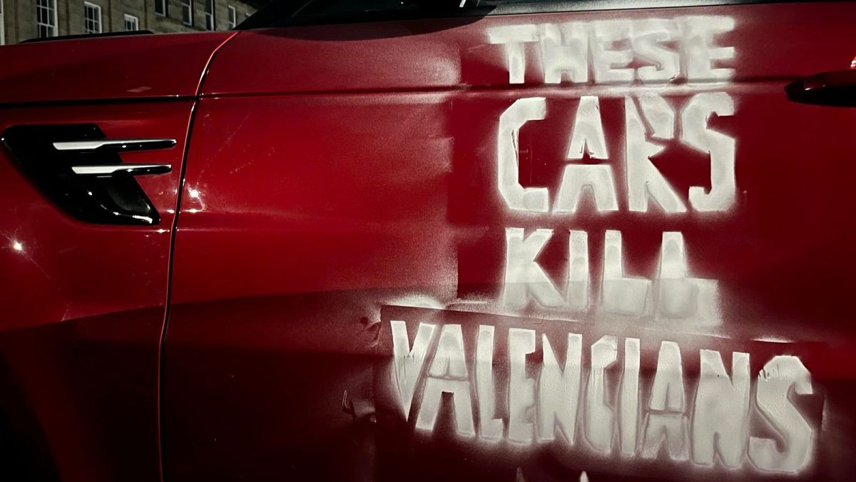 ‘These cars kill Valencians’: Climate activists target SUVs in solidarity with flood victims