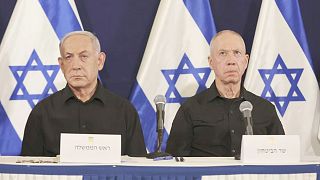 FILE: Israeli Prime Minister Benjamin Netanyahu, left and Defence Minister Yoav Gallant attend a press conference in the Kirya military base in Tel Aviv, 28 October 2023