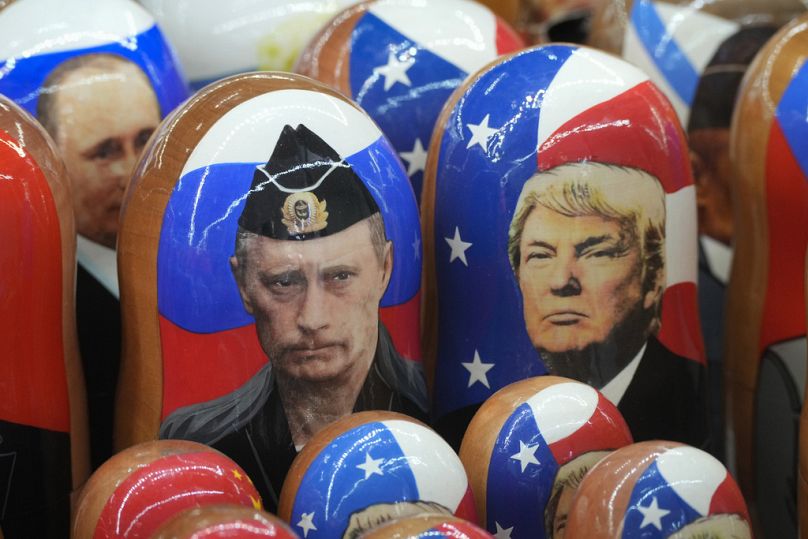 Traditional Russian wooden dolls, called Matryoshka, depicting Republican presidential nominee an former US President Donald Trump, right, and Russian President Vladimir Putin