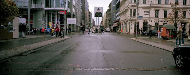 Stones on the street mark the course of the former Berlin Wall near the former Checkpoint Charlie in Berlin, Monday, Nov. 4, 2024.