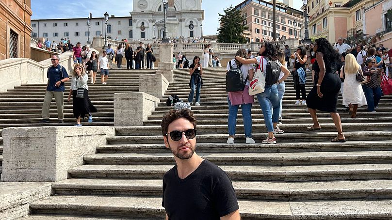 Journalist Andrea Carlo in front of the popular tourist landmark, the Spanish Steps, near where he lives, September 2024. 