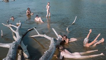A crew from Liquid Becoming cool off during river voyage exploration A crew from Liquid Becoming cool off during river voyage exploration
