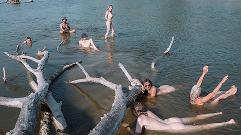 A crew from Liquid Becoming cool off during river voyage exploration 