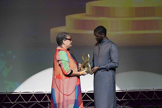 Artist Agnès Brezephin from the Martinique island is presented the Léopold Sédar Senghor by Senegalese president Bassirou Diomaye Faye