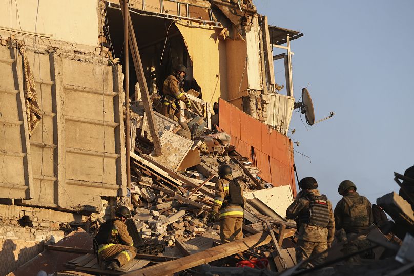 Rescue workers clear the rubble of a residential building destroyed by a Russian airstrike in Zaporizhzhia, 7 November, 2024