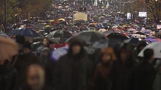 People march during a protest following the collapse of a concrete canopy at the railway station in Novi Sad that killed 14 people, in Belgrade, Serbia, Monday, Nov. 11, 2024.