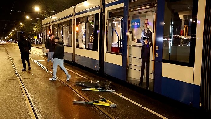 Dutch police disperse people from streets after Amsterdam tram set on fire