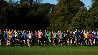 Runners compete in the parkrun event in Bushy Park, southwest London, Saturday, 28 September 2024. 