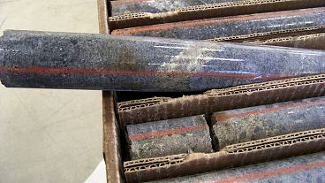 File picture of a core sample drilled from underground rock in the US shows a band of shiny minerals containing copper, nickel and precious metals File picture of a core sample drilled from underground rock in the US shows a band of shiny minerals containing copper, nickel and precious metals